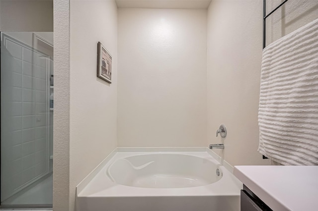 full bath featuring a shower, a garden tub, and vanity