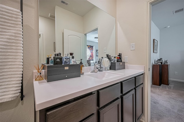 bathroom with vanity and visible vents