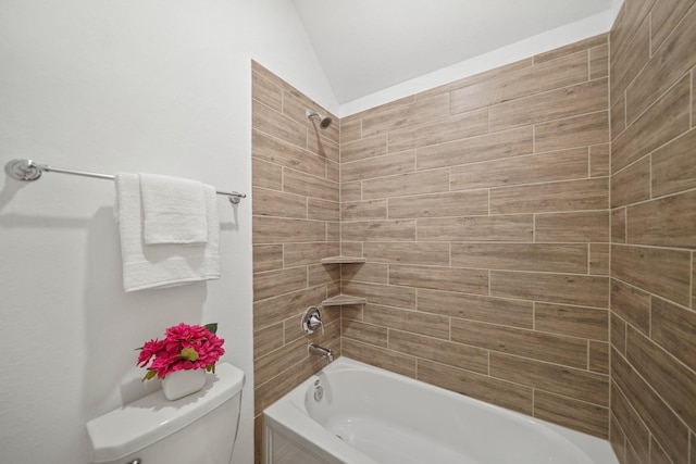 full bath with toilet, vaulted ceiling, and tub / shower combination