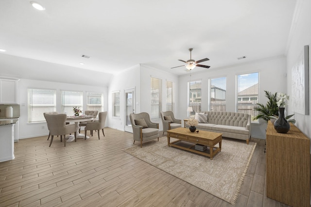 living room with light wood-style floors, recessed lighting, and visible vents