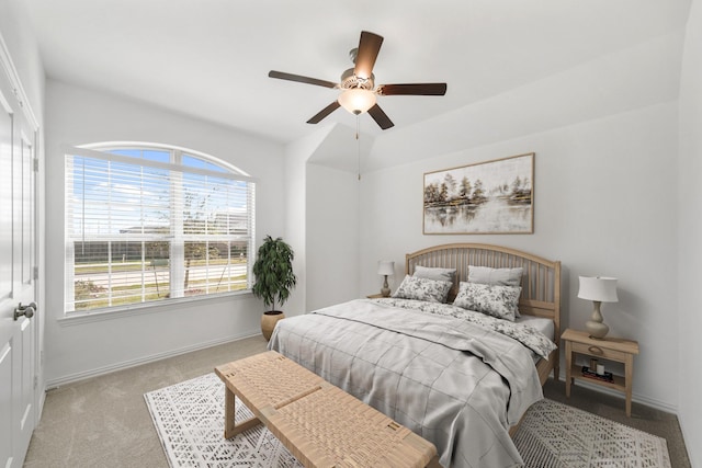 carpeted bedroom featuring a ceiling fan and baseboards