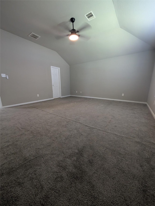 bonus room featuring lofted ceiling, ceiling fan, visible vents, and baseboards