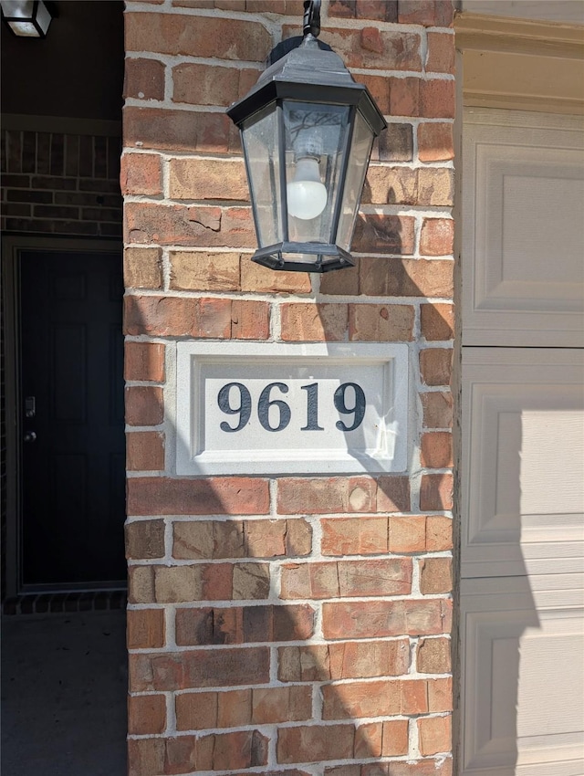 exterior details featuring brick siding