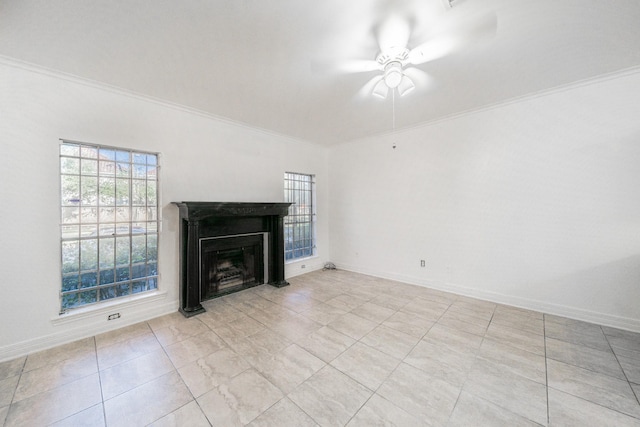 unfurnished living room featuring a fireplace, a ceiling fan, and crown molding