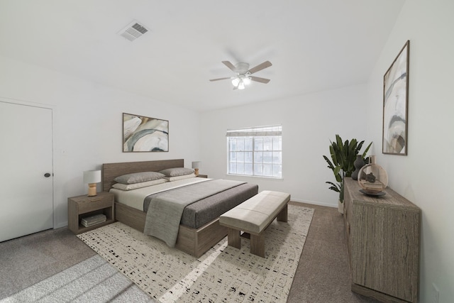 bedroom with baseboards, carpet flooring, visible vents, and a ceiling fan