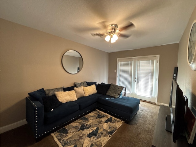 living area with carpet flooring, ceiling fan, and baseboards