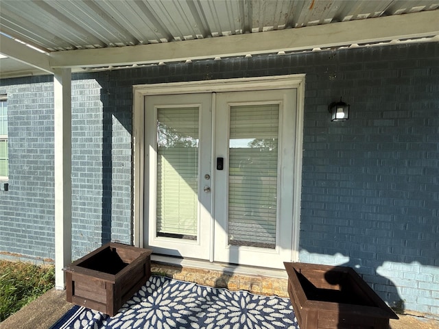 property entrance with brick siding