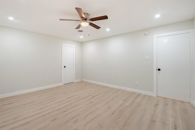 empty room with light wood-style floors, ceiling fan, baseboards, and recessed lighting