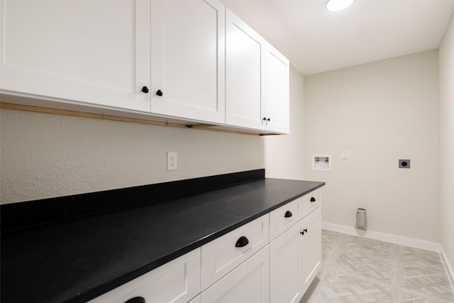 laundry area featuring washer hookup, cabinet space, baseboards, and hookup for an electric dryer