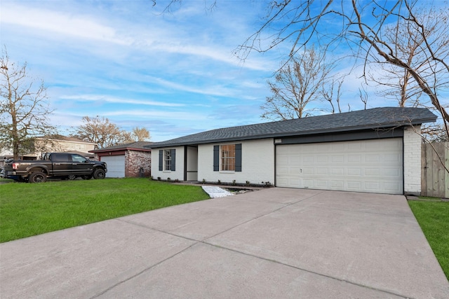 ranch-style home featuring driveway, roof with shingles, an attached garage, a front yard, and brick siding