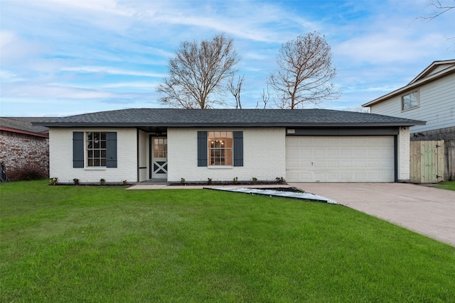 ranch-style house with a garage, brick siding, fence, concrete driveway, and a front yard