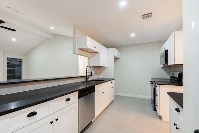 kitchen featuring stainless steel appliances, a sink, visible vents, white cabinets, and dark countertops