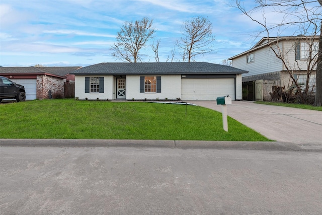 view of front of property with a garage, brick siding, fence, concrete driveway, and a front yard