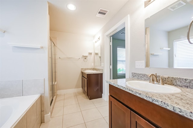 full bathroom featuring a stall shower, visible vents, and a sink