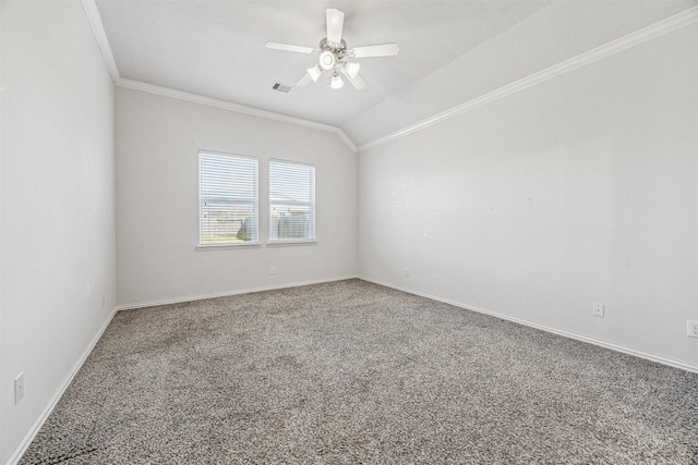 carpeted spare room with crown molding, visible vents, a ceiling fan, vaulted ceiling, and baseboards