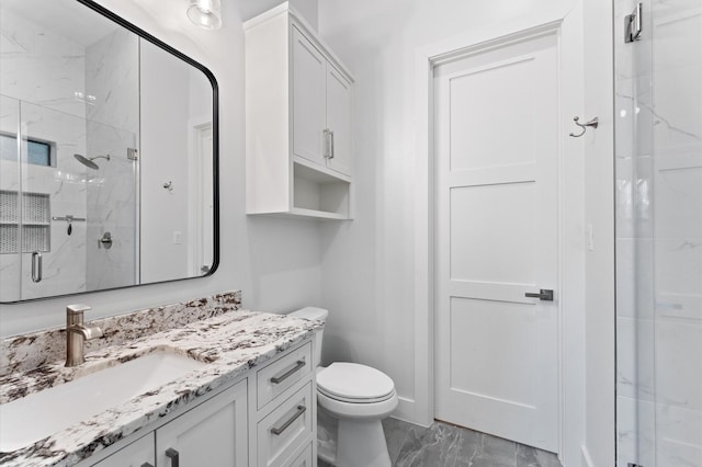 bathroom with a marble finish shower, toilet, marble finish floor, and vanity