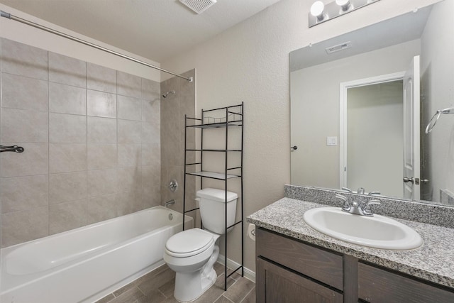 full bath featuring toilet, visible vents, tub / shower combination, and vanity