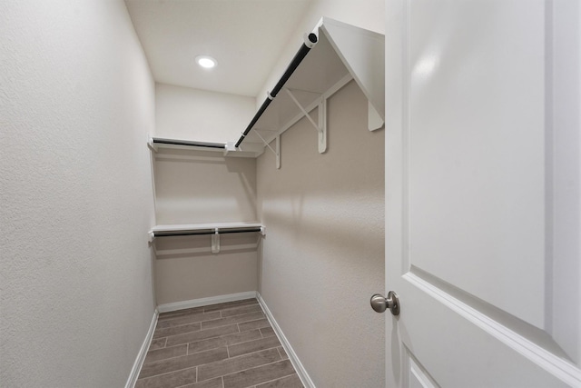 spacious closet featuring wood finish floors