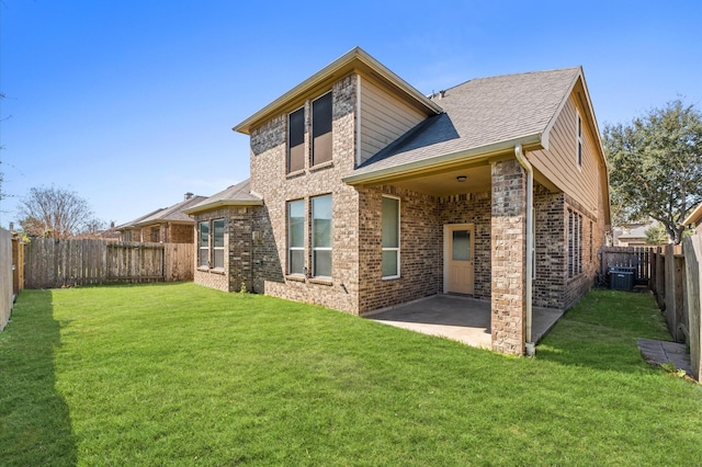 back of house with brick siding, a patio, a lawn, central AC unit, and a fenced backyard