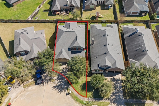 birds eye view of property with a residential view