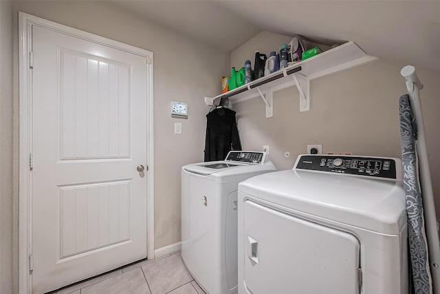 laundry area with light tile patterned floors, laundry area, and independent washer and dryer