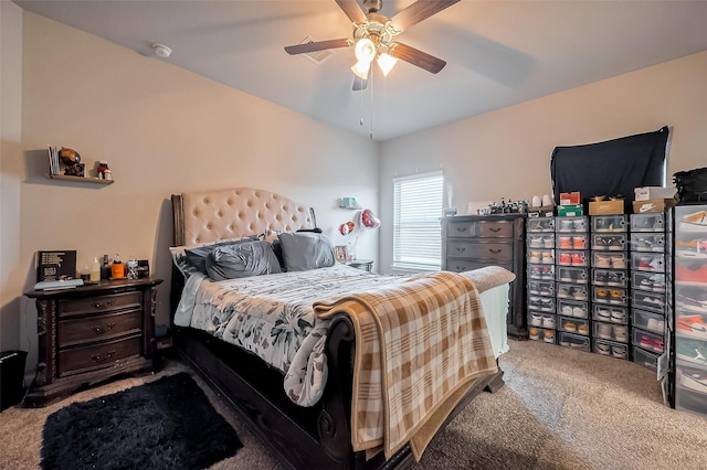 carpeted bedroom featuring lofted ceiling and ceiling fan