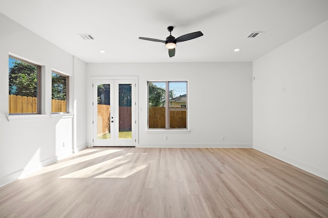 unfurnished room featuring french doors, recessed lighting, visible vents, light wood-style floors, and baseboards