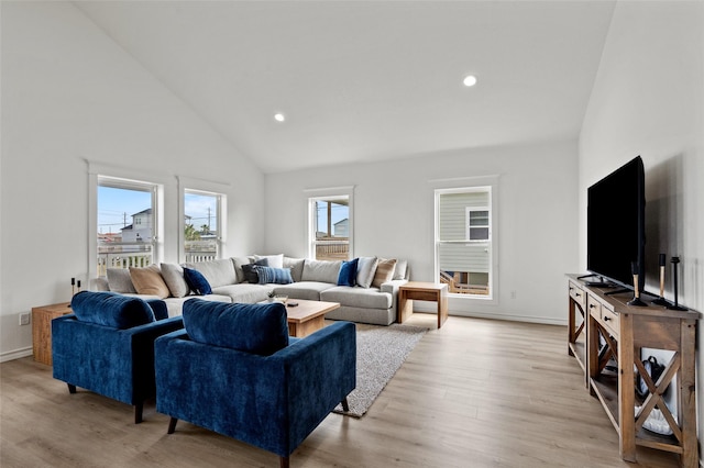 living room featuring light wood-style flooring, high vaulted ceiling, baseboards, and recessed lighting