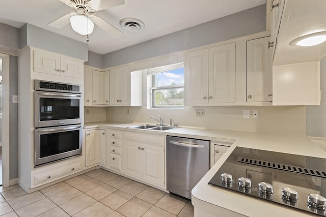 kitchen featuring light countertops, visible vents, appliances with stainless steel finishes, light tile patterned flooring, and a sink