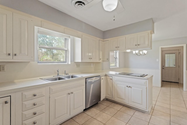 kitchen with light countertops, stainless steel dishwasher, a sink, a peninsula, and black electric cooktop