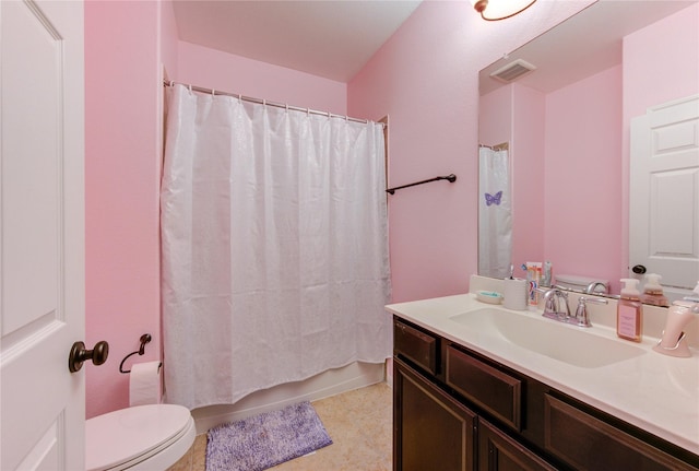 bathroom featuring visible vents, vanity, toilet, and shower / bathtub combination with curtain