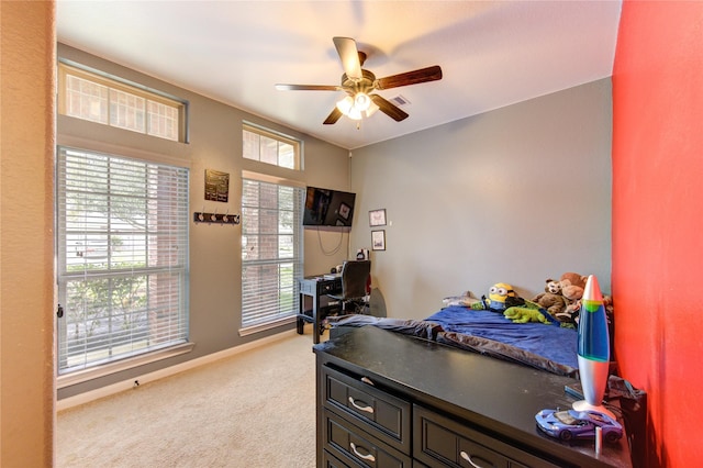 bedroom featuring light carpet, ceiling fan, visible vents, and baseboards