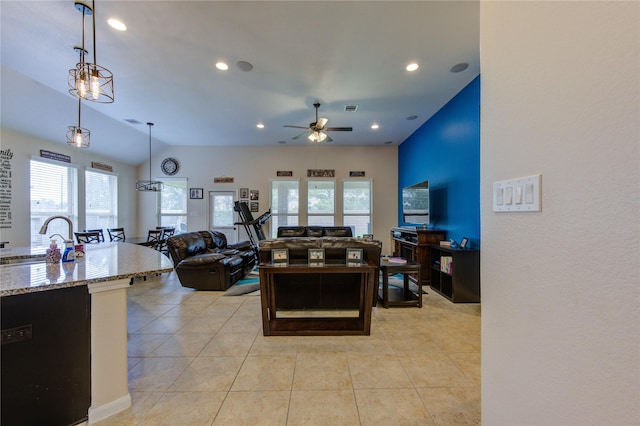 living area featuring light tile patterned floors, vaulted ceiling, a ceiling fan, and recessed lighting