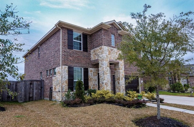 view of front facade featuring stone siding and brick siding