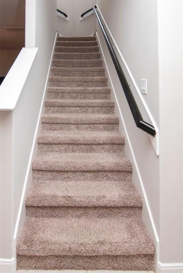 staircase with baseboards