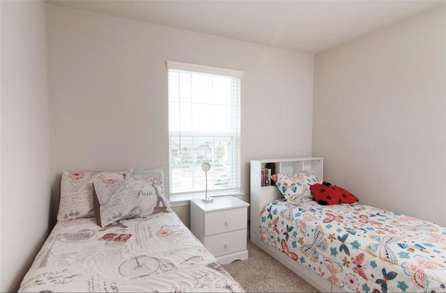 bedroom with light carpet