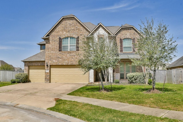 view of front facade with brick siding, concrete driveway, a front lawn, and fence