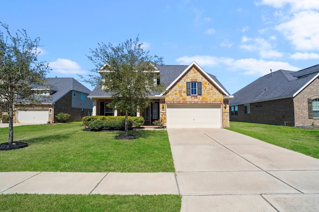 traditional-style house featuring driveway, stone siding, a garage, and a front lawn