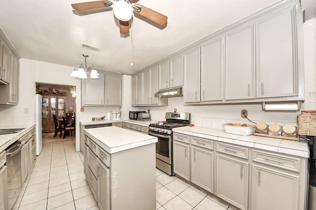 kitchen with gray cabinetry, appliances with stainless steel finishes, visible vents, and under cabinet range hood