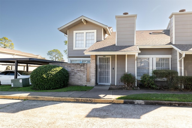 6341 Shadow Tree Dr, Houston, TX 77035 - view of front facade featuring roof with shingles and a chimney
