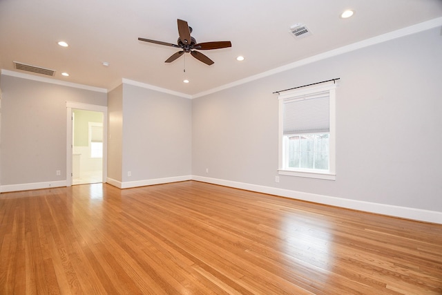 spare room featuring light wood finished floors, visible vents, recessed lighting, and baseboards