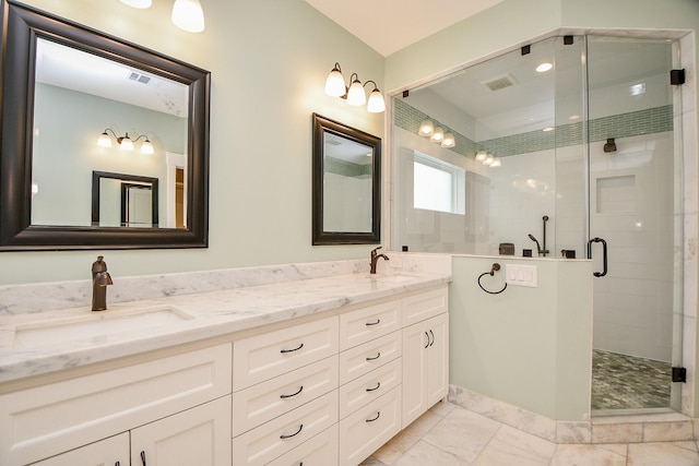 bathroom with double vanity, visible vents, a shower stall, and a sink