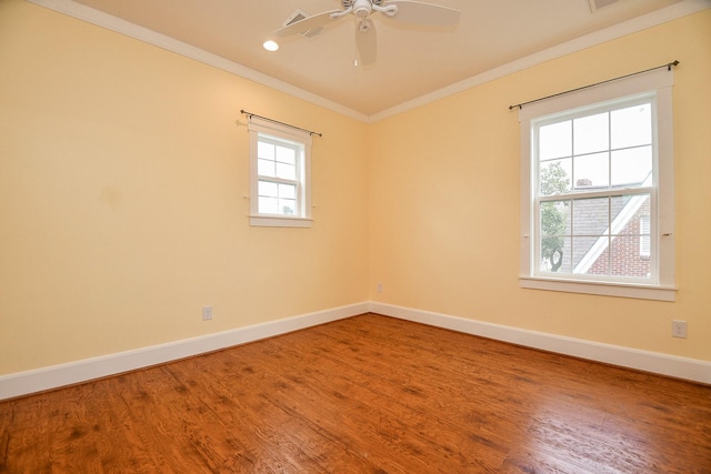 spare room featuring wood finished floors, baseboards, recessed lighting, ceiling fan, and ornamental molding