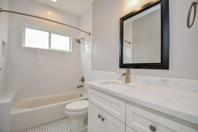 full bathroom with tub / shower combination, toilet, vanity, and tile patterned floors