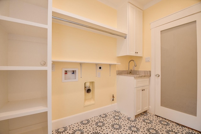 laundry room with electric dryer hookup, washer hookup, a sink, cabinet space, and gas dryer hookup