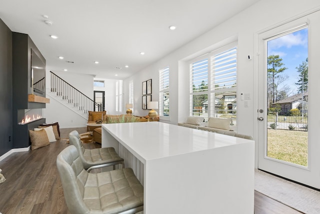 kitchen featuring recessed lighting, dark wood-type flooring, and light countertops