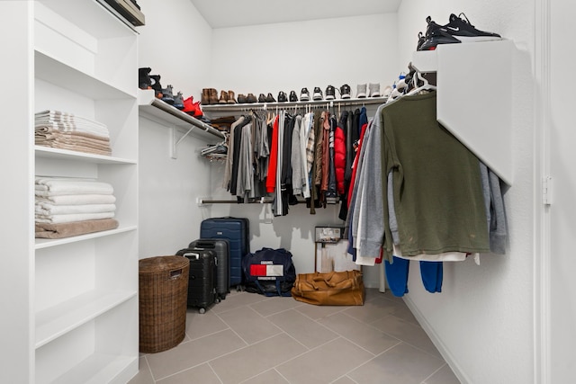 spacious closet featuring tile patterned flooring