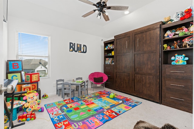 playroom with baseboards, a ceiling fan, and carpet flooring