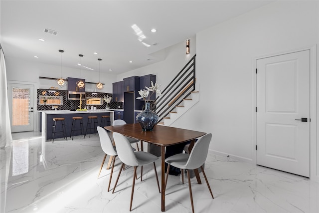 dining room with marble finish floor, stairs, visible vents, and recessed lighting