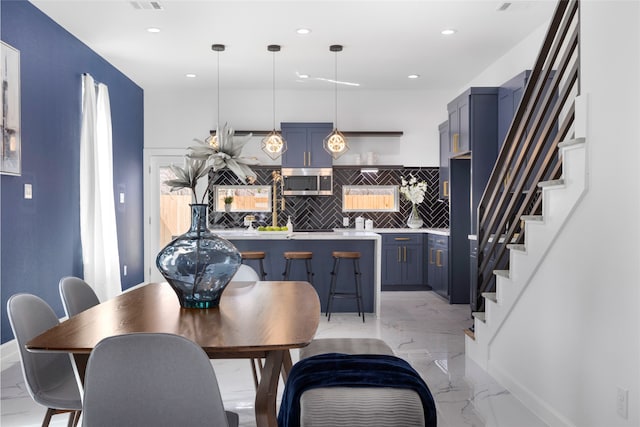 dining room with marble finish floor, visible vents, stairway, and recessed lighting